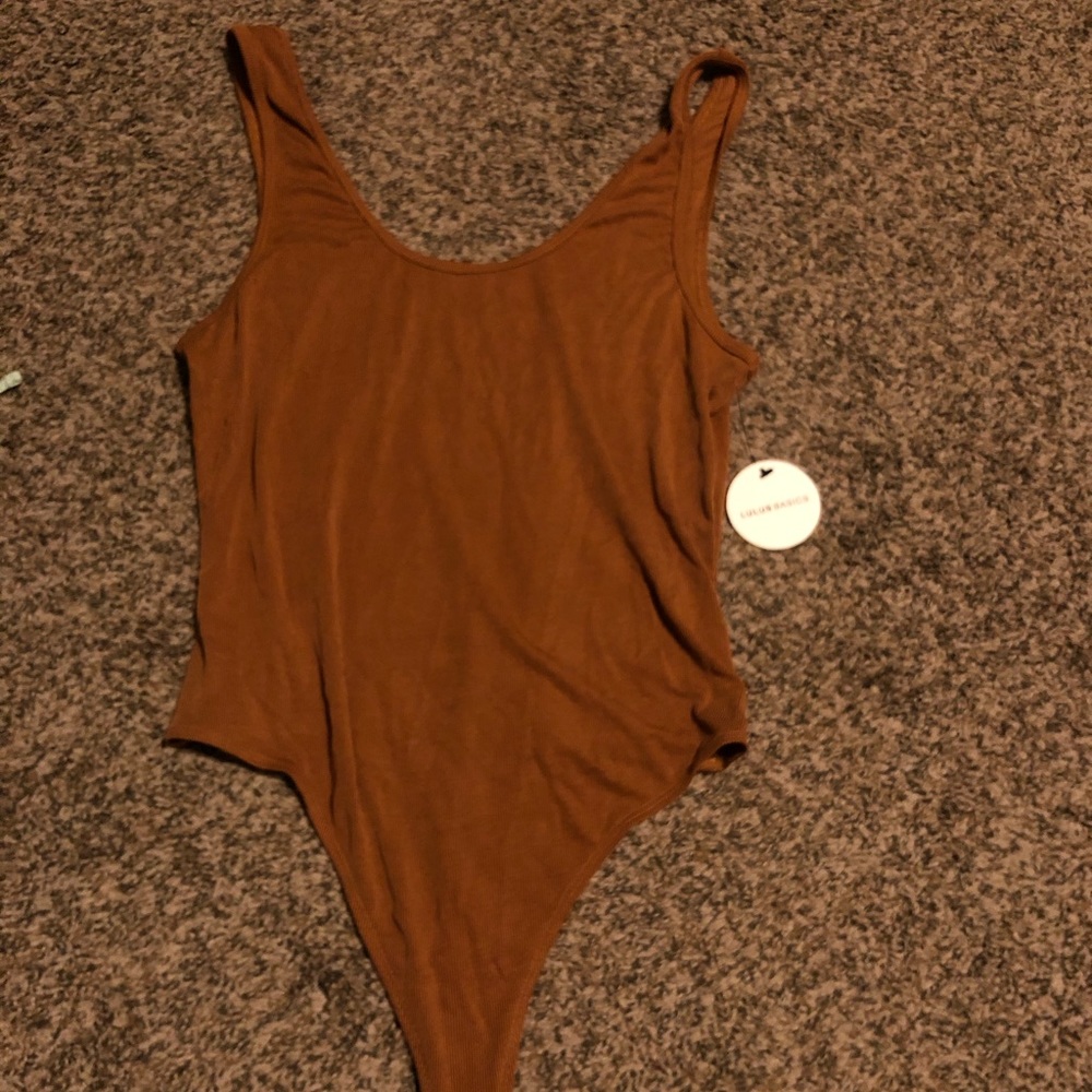 Tan Thong leotard, never used